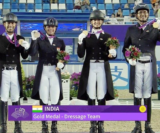 Indian Dressage Team posing with Gold Medal.