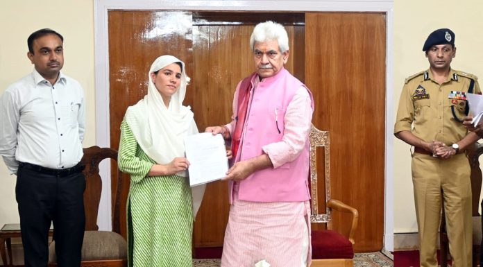 LG Manoj Sinha handing over appointment letter to next of kin of a militancy victim in Jammu on Tuesday.