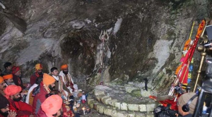 Sadhus led by Mahant Deependra Giri Ji performing Puja at holy cave after Chhari Mubarak reached there on Thursday.