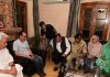 LG Manoj Sinha with family members of martyr DySP Humayun Bhat at their residence in Srinagar.