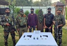 Two militants of TRF in police custody in Baramulla. — Excelsior/Abid Nabi