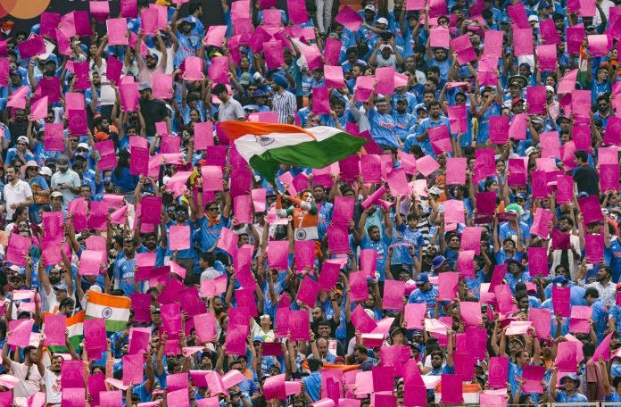 Fans cheer during the ICC Men's Cricket World Cup 2023 match between India and Pakistan, at Narendra Modi Stadium, in Ahmedabad