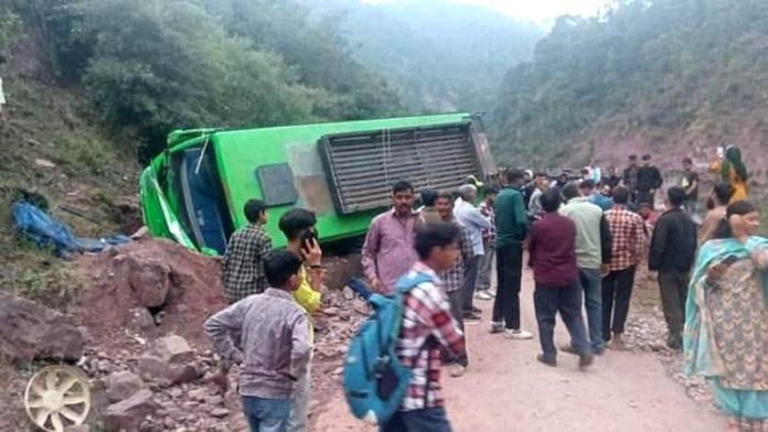 Minibus lying on roadside after meeting with accident near Ghordi on Sunday evening.