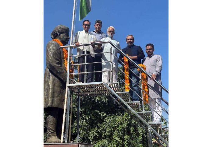 Representatives of Pt Prem Nath Dogra Trust garlanding the statue of Sher-e -Duggar at Jammu on Monday.