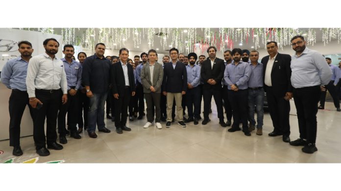 Prominent Hyundai Mobis executives with AM Hyundai management and staff in Jammu on Monday.