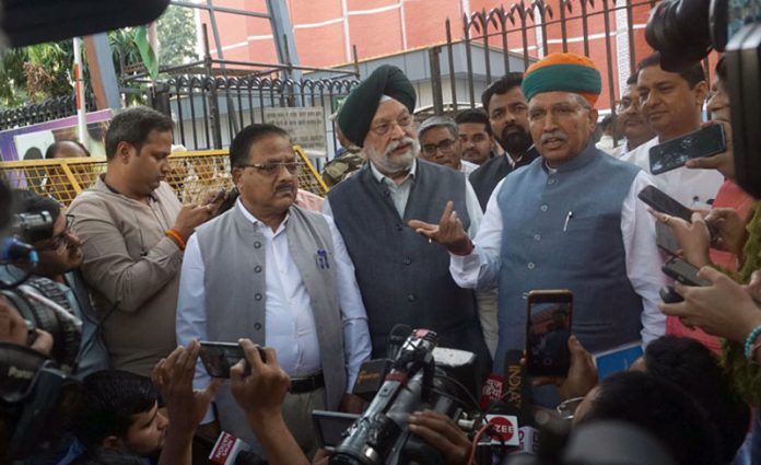 BJP delegation comprising Union Ministers Hardeep Singh Puri, Arjun Meghwal party leaders Radha Mohan Agarwal, Anil Baluni, Om Pathak talking to newsmen while coming out of Election Commission after meeting Chief Election Commissioner, in New Delhi on Wednesday. (UNI)