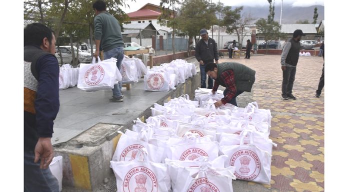 Election material being dispatched to polling stations in Kargil on Monday. — Excelsior/Basharat Ladakhi