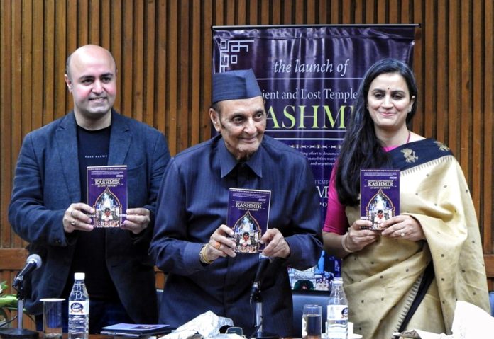 Dr Karan Singh releasing a book in New Delhi on Sunday.