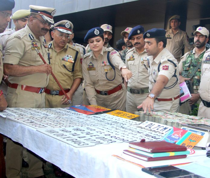 DGP Dilbag Singh witnessing recoveries made from narcotics smugglers at Police Headquarters in Jammu. — Excelsior/Rakesh