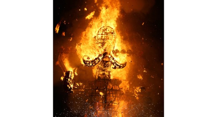 Effigy of demon King Ravana in flames during Dussehra celebrations at Parade Ground on Tuesday. -Excelsior/Rakesh