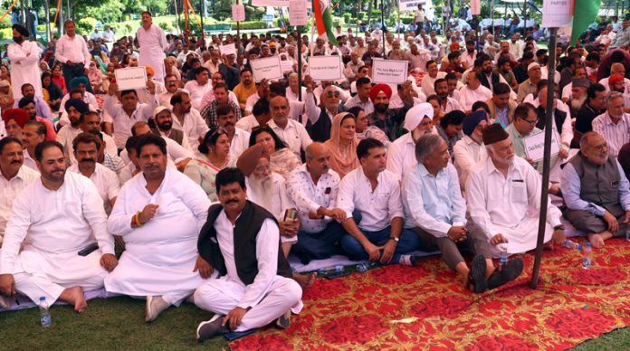 Opposition parties at a sit in protest in Maharaja Hari Singh Park Jammu on Tuesday. -Excelsior/Rakesh