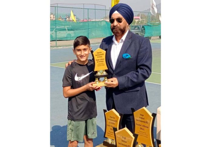 General Secretary, JKLTA B S Jaggi presenting a trophy to a winner in Srinagar.