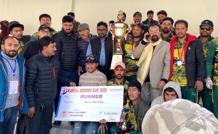 Winning team posing with dignitaries during Kargil Heroe's Cup 2023 final.