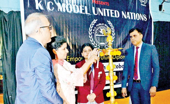 Subha Mehta, Joint Director of Education lighting lamp to begin KCMUN conference on Saturday.