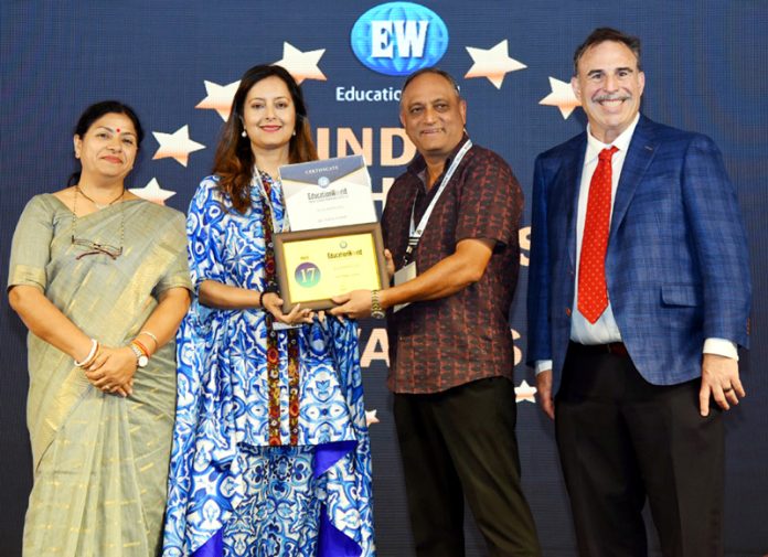 Raju Chowdhary, Chairman and Arti Chowdhary, MD of KC Public School receiving the award for retaining 1st Position in School Ranking Survey.