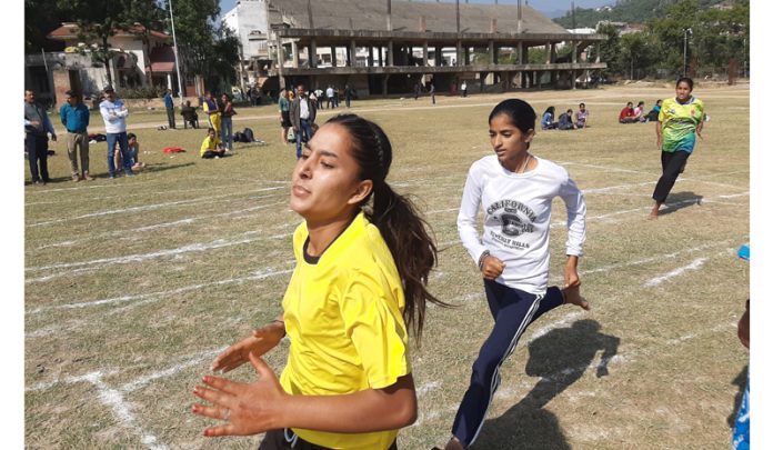 Players in action during athletics meet at Udhampur on Friday.