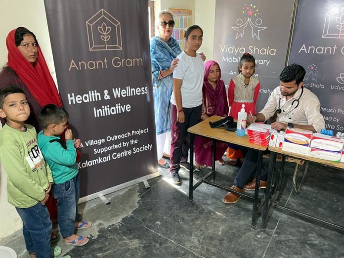 Doctor checking the patients during a health check-up camp in Jammu on Sunday.