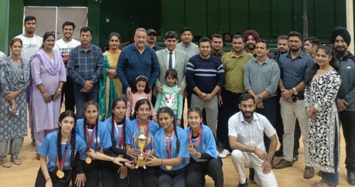 Yoga team posing with trophy along with dignitaries on Friday.