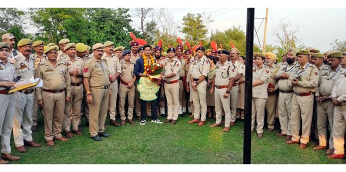 SSP Samba, Benam Tosh honouring an achiever at a function at Samba on Sunday.