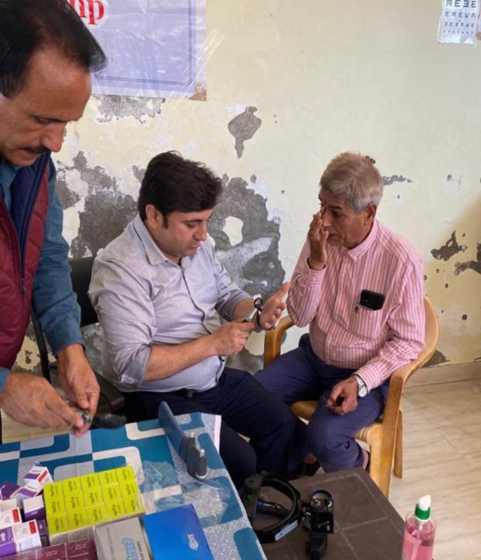 A doctor examining a patient during an eye camp at Nagrota Gujroo.