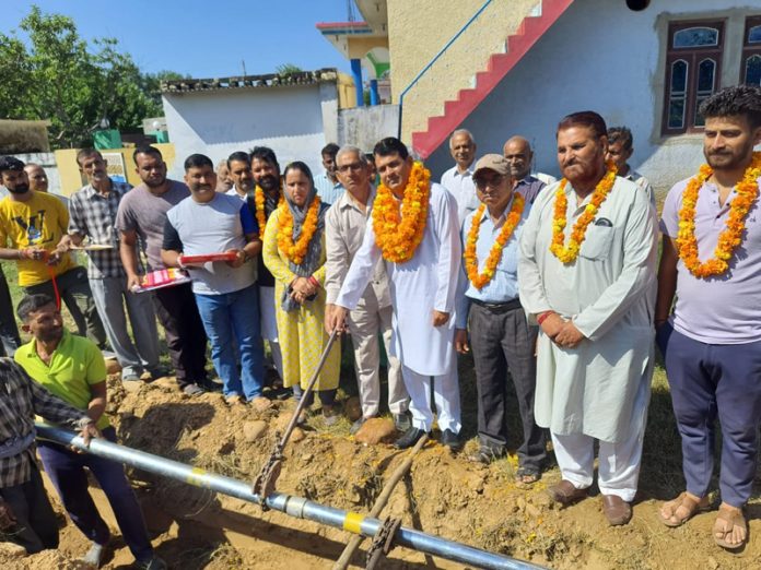 DDC member Pandit Suresh Sharma inaugurating work of laying water supply pipe on Wednesday.