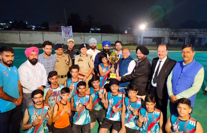 Dignitaries presenting trophy to the captain of winning Kho-Kho team.