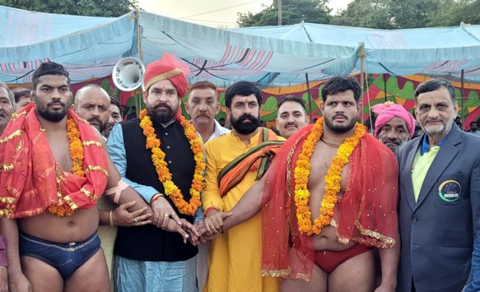 YRS president Vikram Singh Vicky and other guests posing with wrestlers during Baba Kailak Nath Dangal at Bantalab, Jammu.