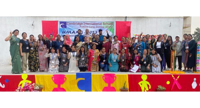 Winners of various competitions posing with guests, dignitaries and teachers at CIS Jammu.