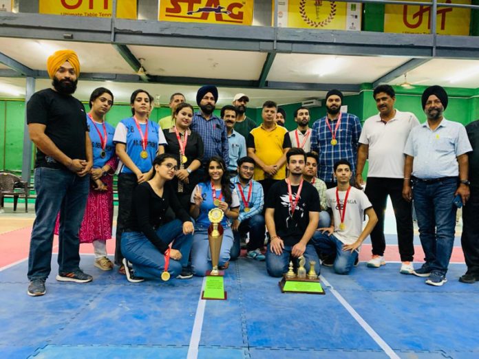 Chess players posing with trophies in Jammu University on Friday.