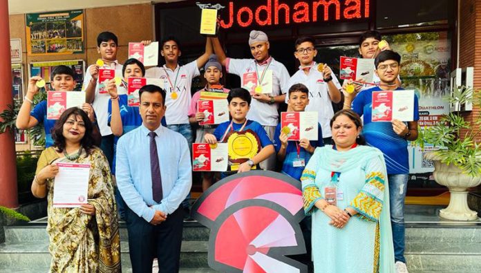 Formula-1 team of Jodhamal School posing with school management.