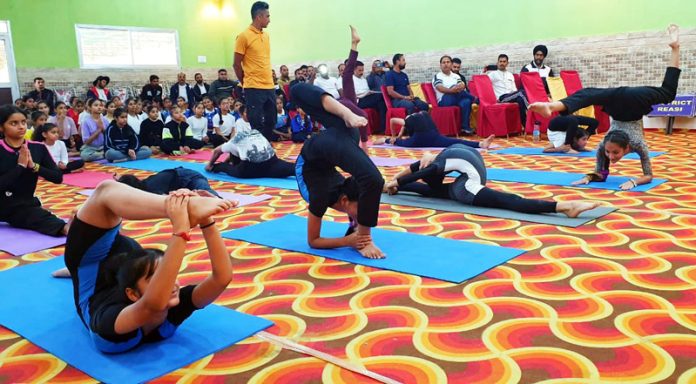 Players performing Yoga in Reasi.