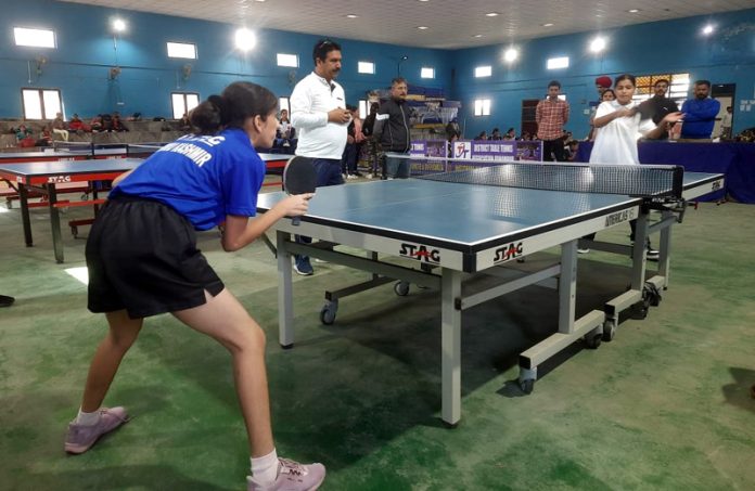 Table Tennis players in action during a match at Udhampur.