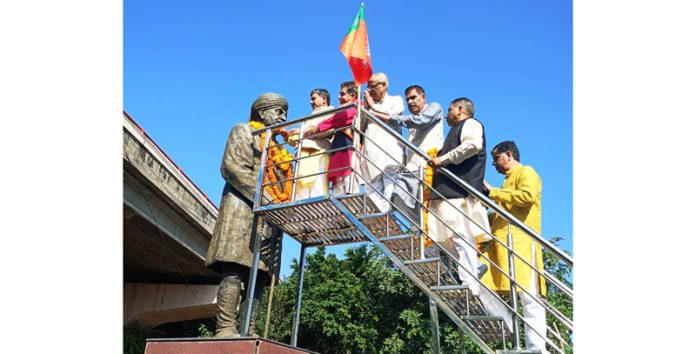 BJP leaders garlanding statue of Sher-e-Duggar Pt Prem Nath Dogra at Jammu on Tuesday.