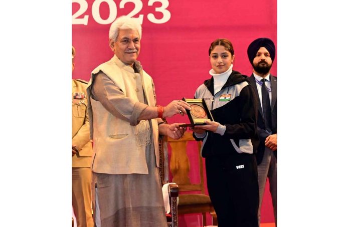 LG honouring Women Achiever in a function at Srinagar on Thursday.
