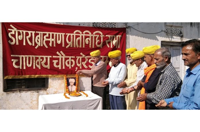 Members of Dogra Brahman Pratinidhi Sabha paying tribute to Pt Prem Nath Dogra on his birth anniversary.