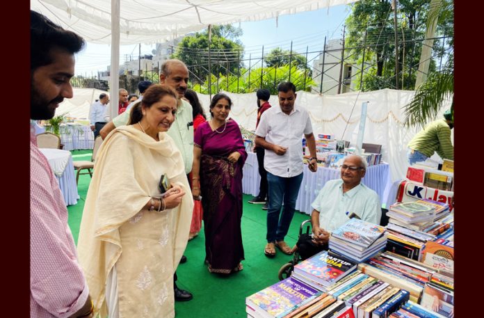 Director DD & OE, Prof Neelu Rohmetra inspecting a book stall during 'Pustak Gyaan Pradarshanee' at University of Jammu on Tuesday.