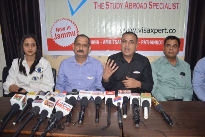 Visaxpert MD and Director addressing a press conference at Jammu on Saturday.