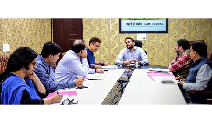 Deputy Commissioner Jammu chairing a meeting.