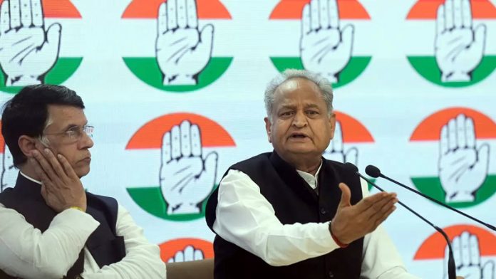 Senior Congress leader and Rajasthan Chief Minister Ashok Gehlot with party leader Pawan Khera addresses the media at AICC Hq., in New Delhi (UNI).