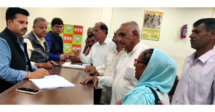 BJP leaders listening public grievances at party office, Jammu on Saturday.