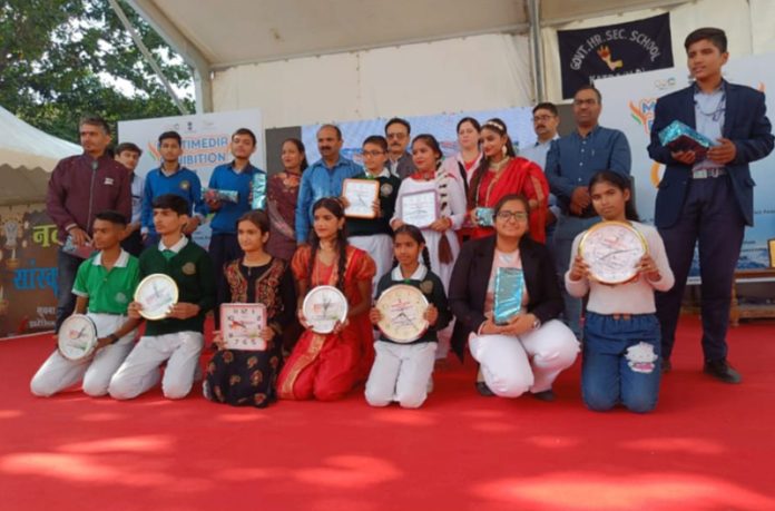 Students posing with certificates on Sunday.