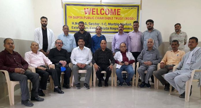 Team members of T.R Gupta Public Charitable Trust posing for a group photograph during a Medical Camp at Teryath in Rajouri.