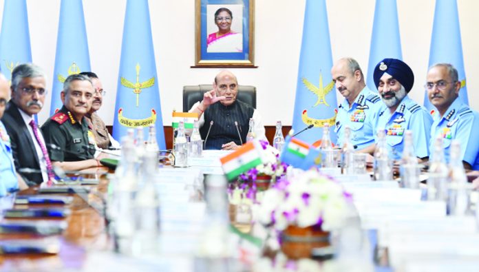 Defence Minister Rajnath Singh with Chief of Defence Staff General Anil Chauhan, Chief of Air Staff Air Chief Marshal VR Chaudhari and others during the Indian Air Force Commanders' Conference, in New Delhi on Thursday. (UNI)