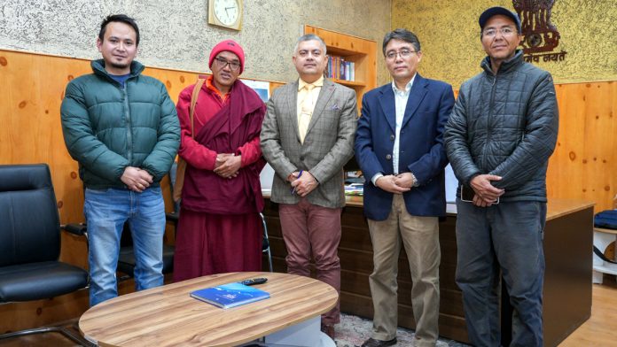 LSF founder Tsering Tashi and his team posing with Secretary IT Ladakh Amit Sharma at his office in Leh.