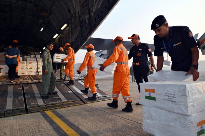 NDRF staff uploading the medical aid and disaster relief material for the people of Palestine at an IAF C-17 flight for EL-Arish airport in Egypt on Sunday. (UNI)