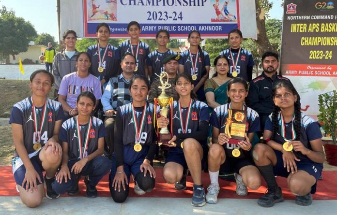 Army Public School Akhnoor girls team of Basketball posing with trophy.