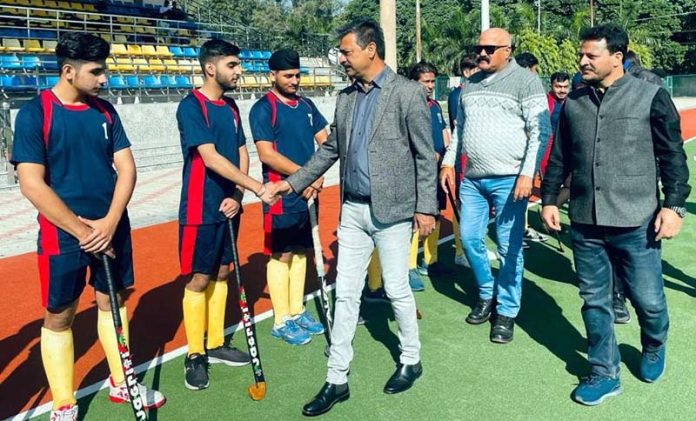 Chief guest interacting with hockey players during Inter College tournament on Friday.