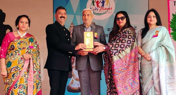 Management of Kids Planet Public School, Akhnoor presenting memento to Senior BJP Leader, Sham Lal Sharma.