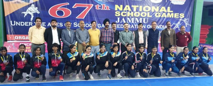 Fencers posing with dignitaries during 67th National School Games at Jammu.