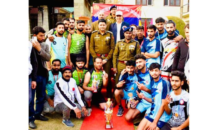 Chief Guest Sundeep Chakarvarty SSP Anantnag along with CO 11th Battalion Sandeep Mehta posing with winning Volleyball team.